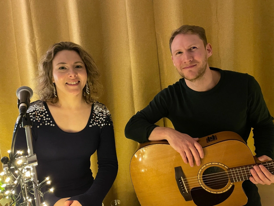 Sarah Locke and singing partner from Smooth Grooves Acoustic posing in front of the camera